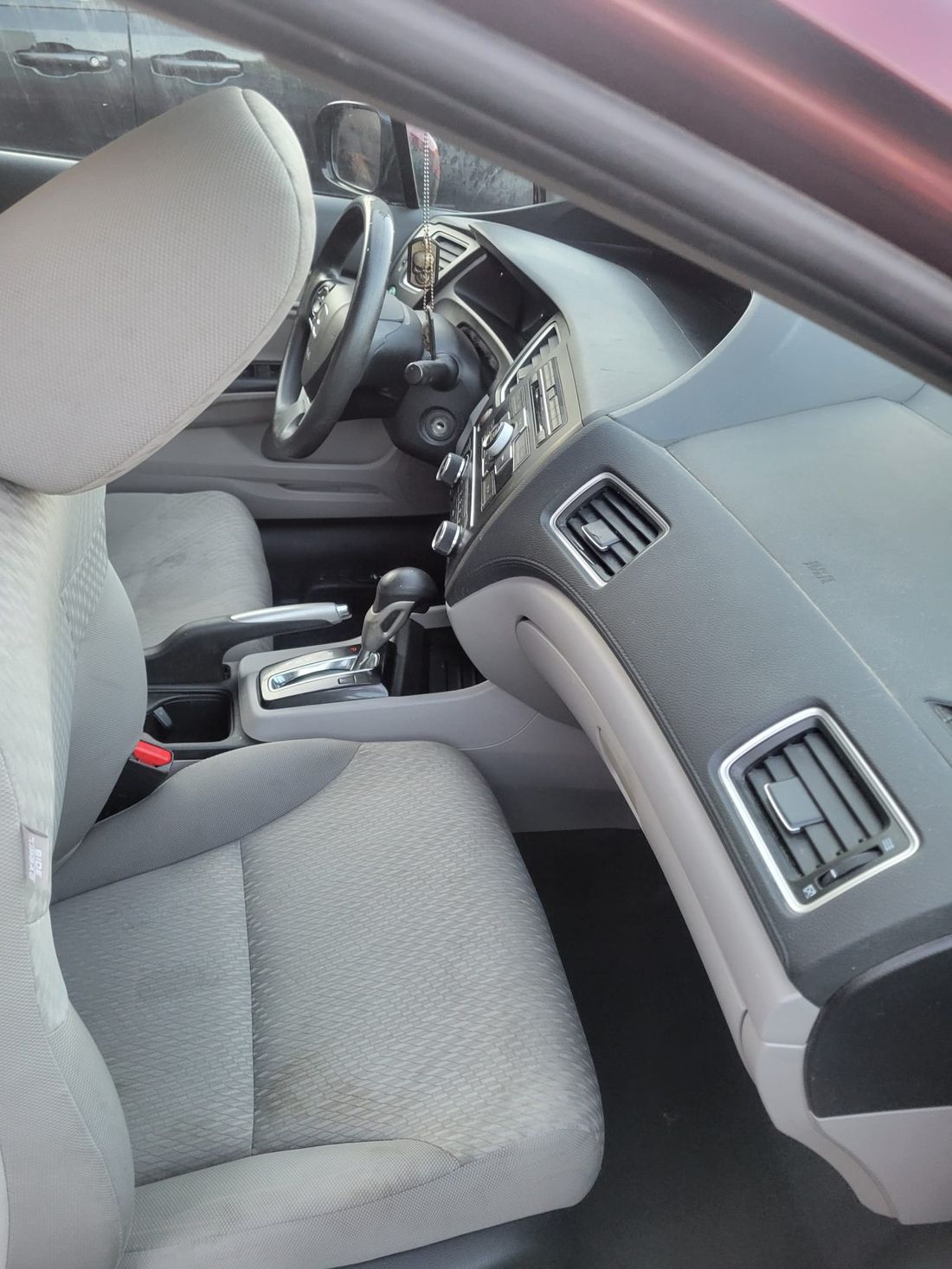 Clean grey cloth interior of a Honda Civic after a full detail